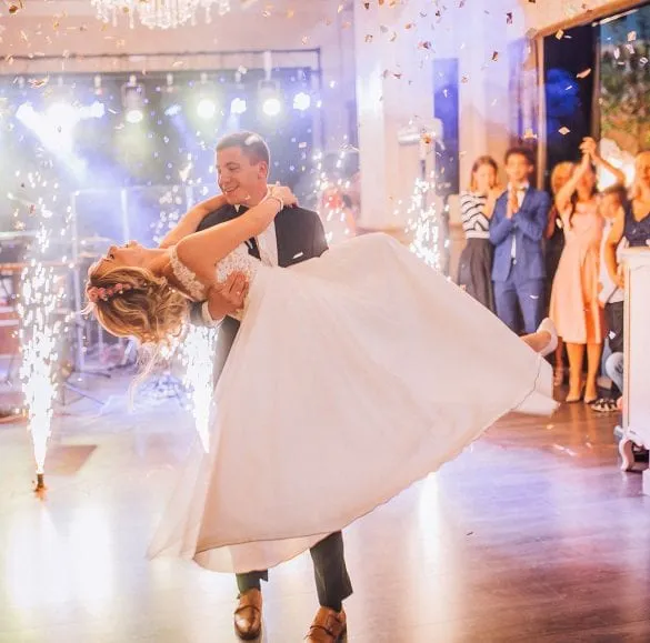 Bride and groom performing their first dance amid sparklers