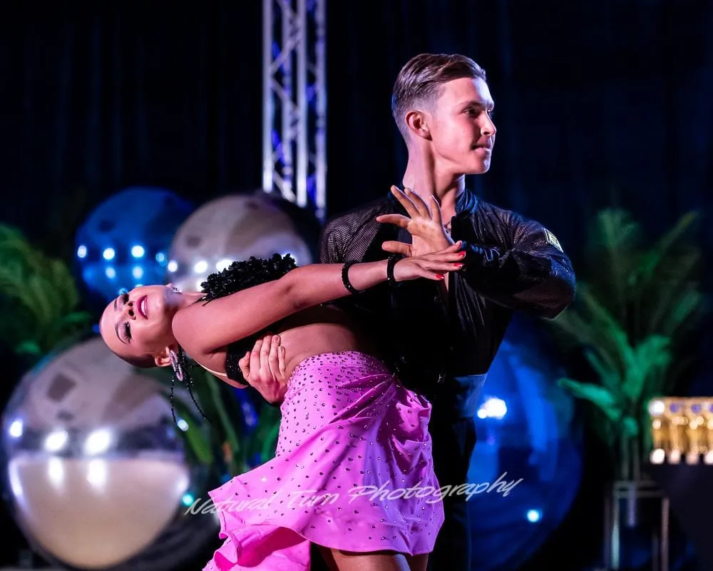 Sophia Baydala and Andrey Ilyushenov in a dramatic Latin showcase pose