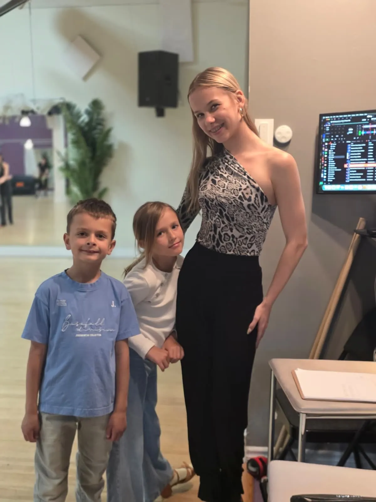Sophia Baydala with two young students at the studio